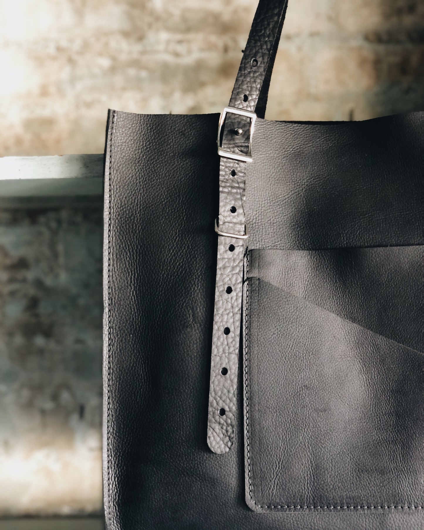 The Wander Black Leather Hand Bag