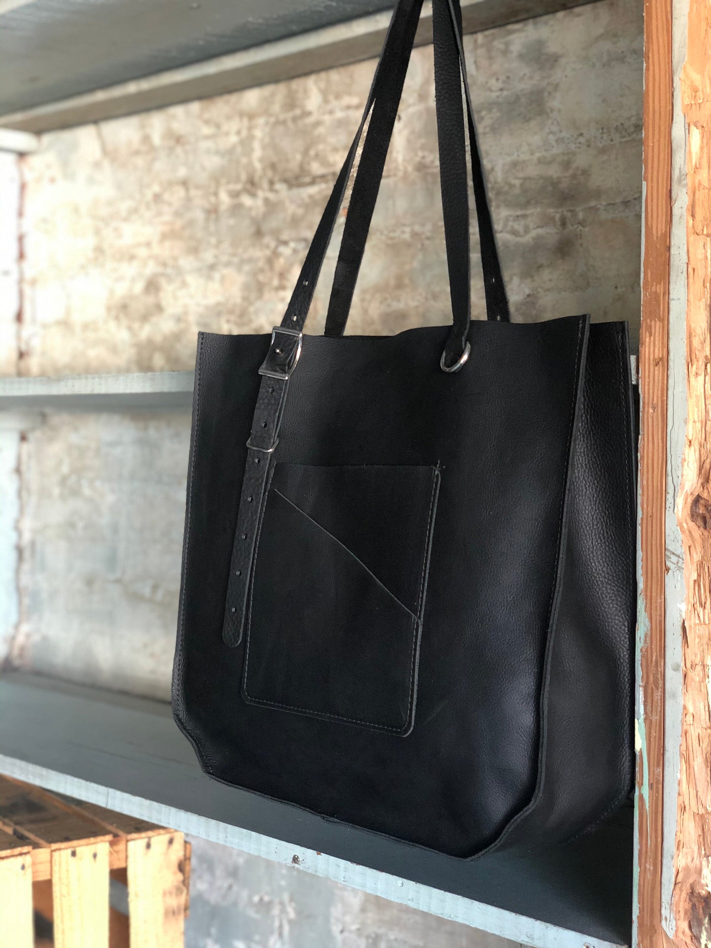 The Wander Black Leather Hand Bag