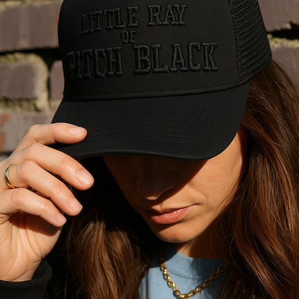 Little Ray of PITCH BLACK Trucker Hat | Otto