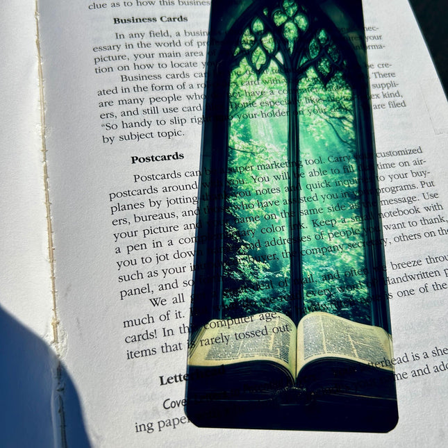 Bible Bookmark – Stained Glass Window Arch with Green Canopy & Glowing Light Over Ancient Open Book