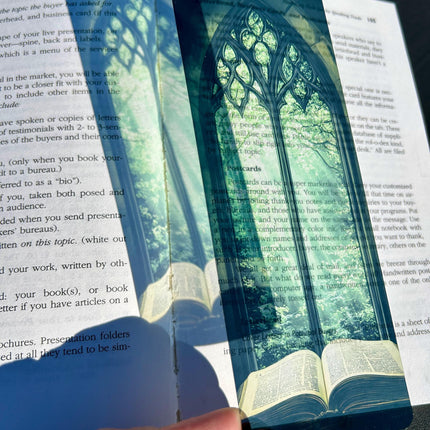 Bible Bookmark – Stained Glass Window Arch with Green Canopy & Glowing Light Over Ancient Open Book