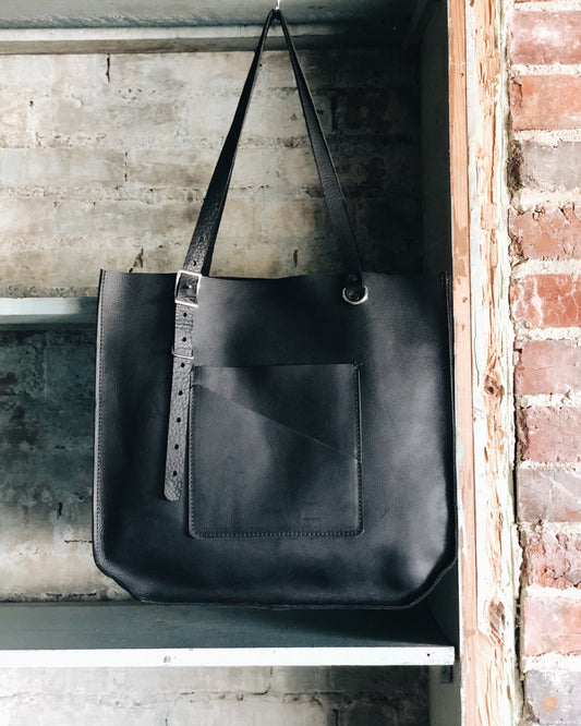 The Wander Black Leather Hand Bag